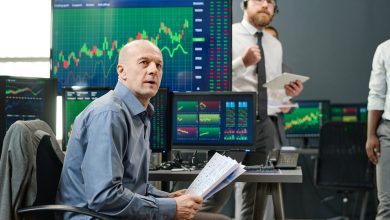 Co Workers Checking Trading Charts
